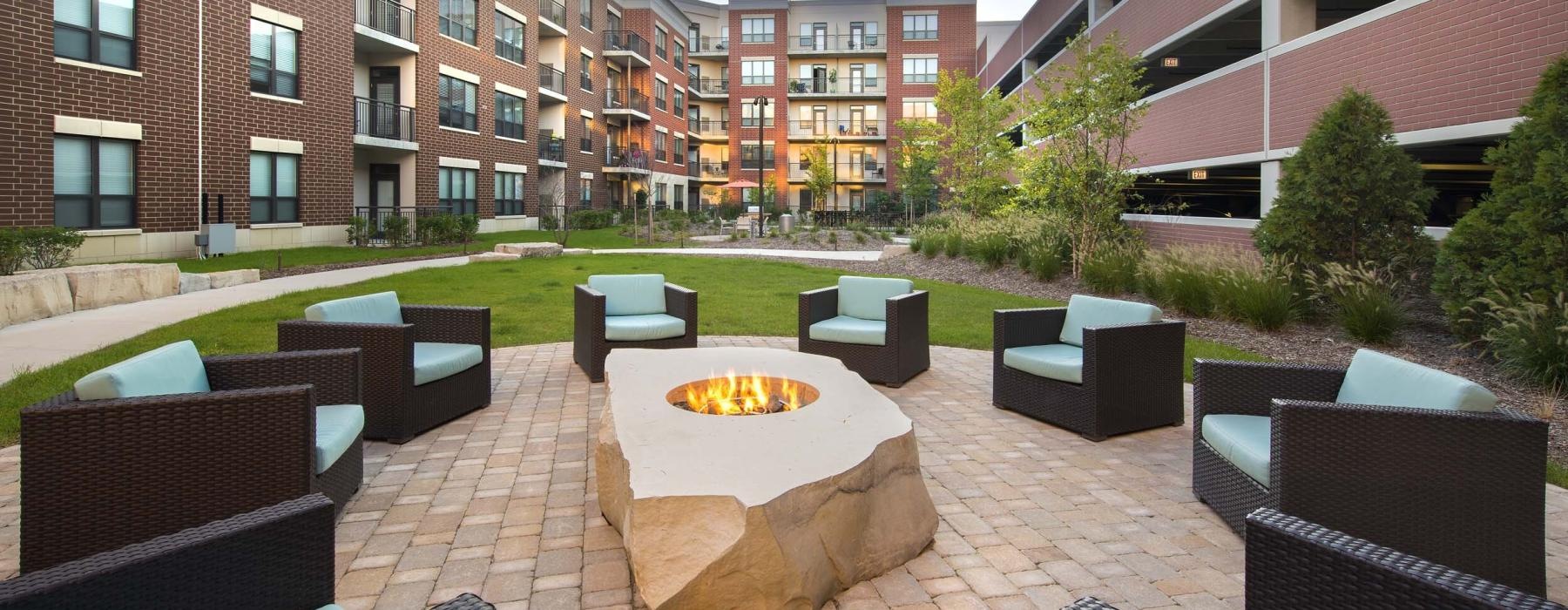 a courtyard with chairs and tables