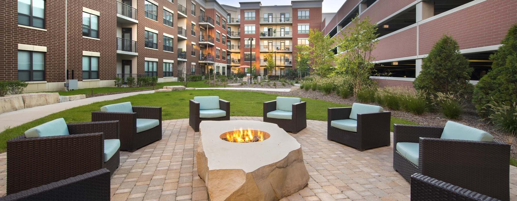 a courtyard with chairs and tables