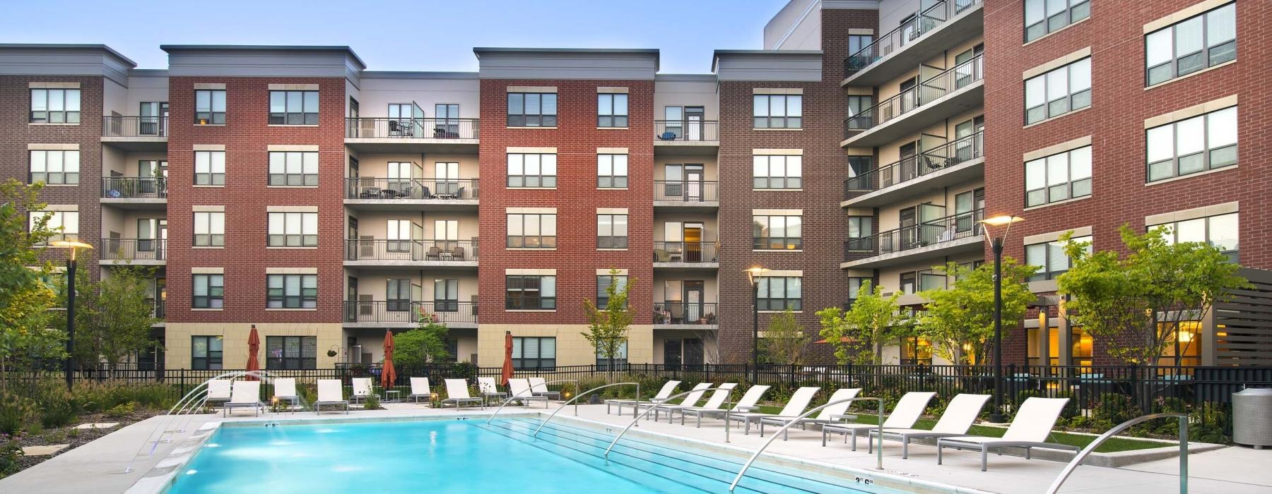 a swimming pool in front of a building