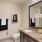 a bathroom with a large mirror