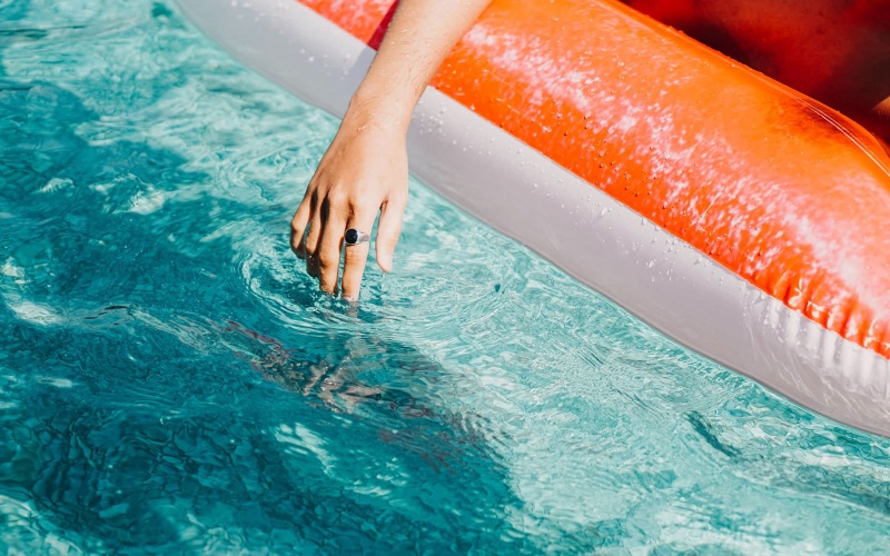 a person in a pool float relaxing